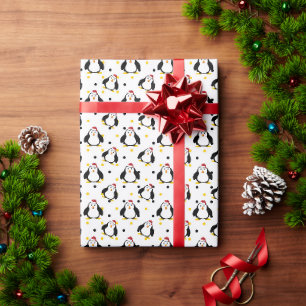 Penguins in christmas mood on white wrapping paper