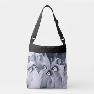 Penguins in snow crossbody bag