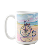 Penny farthing bike parked on beach