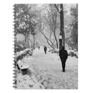 People at park in snowy winter day notebook