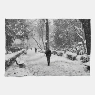 People at park in snowy winter day tea towel