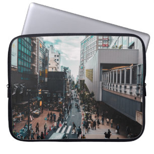 PEOPLE AT THE STREETS OF THE CITY DURING DAY LAPTOP SLEEVE