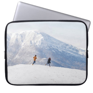 People having fun and running in mountains on the  laptop sleeve