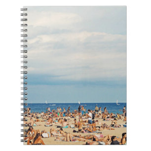 People on brown sand beach notebook