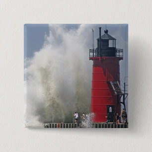 People on jetty watch large breaking waves in 15 cm square badge