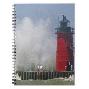 People on jetty watch large breaking waves in 2 notebook