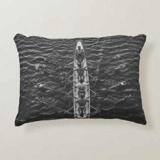 PEOPLE RIDING BOAT ON BODY OF WATER DECORATIVE CUSHION