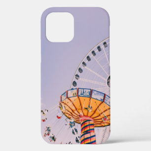 People riding on yoyo ride at daytime iPhone 12 case