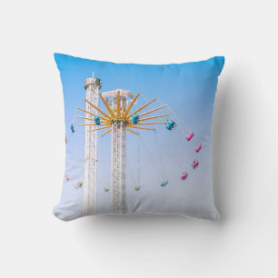 People riding swing amusement ride low-angle photo cushion