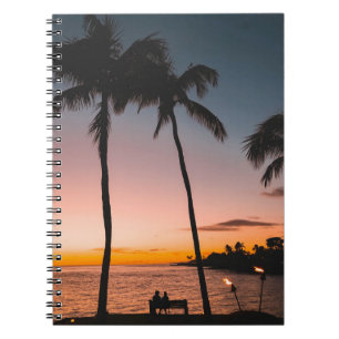 People sitting on beach near sea notebook