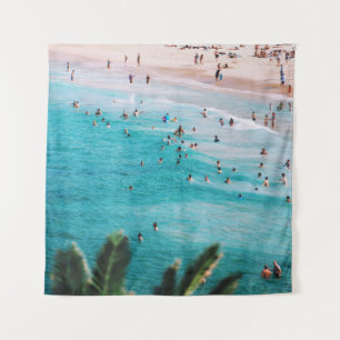 People swimming in the beach tapestry