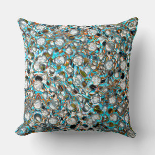 Perforated bluish piece over whitish texture cushion