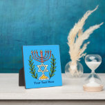 Persian Magen David Menorah Plaque<br><div class="desc">This image was adapted from an antique Persian Jewish tile and features a menorah with a Magen David (Star of David) framed by olive branches.  The imperfections of the original,  hand-painted image have been preserved. Add your own text and you may change the background colour.</div>