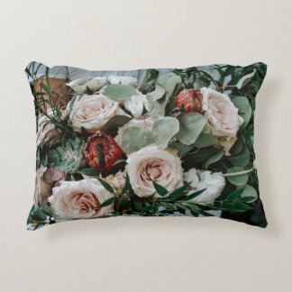 PERSON HOLDING BOUQUET OF PINK AND RED FLOWERS DECORATIVE CUSHION