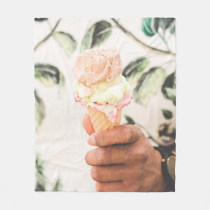 Person holding ice cream cone with three flavours  fleece blanket