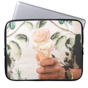 Person holding ice cream cone with three flavours laptop sleeve