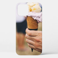 Person holding ice cream on cone
