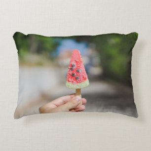 Person holding popsicle in the morning decorative cushion