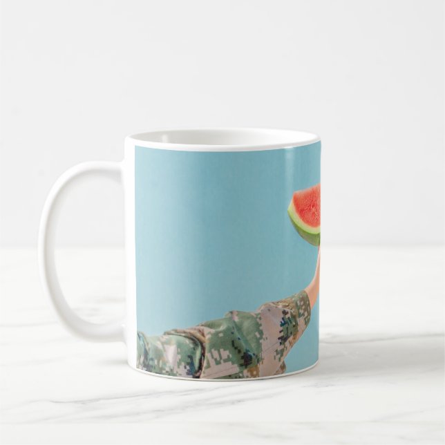 Person holding sliced watermelon coffee mug (Left)