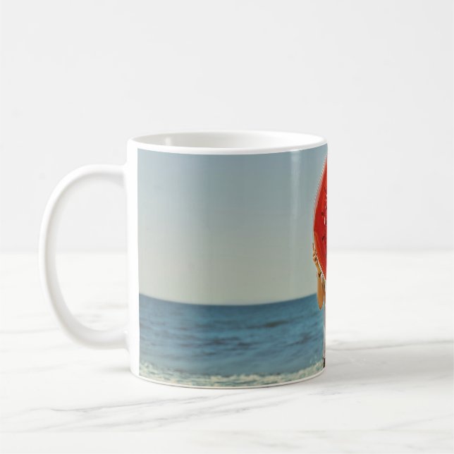 Person holding watermelon-themed inflatable ring coffee mug (Left)