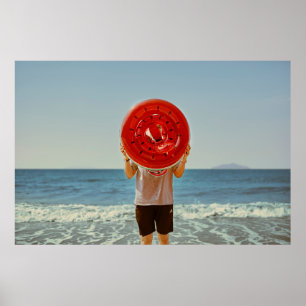 Person holding watermelon-themed inflatable ring poster