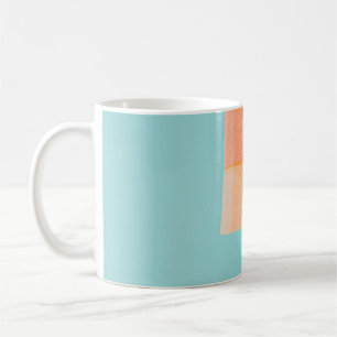 Person holding yellow and brown ice cream cone coffee mug