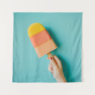 Person holding yellow and pink popsicle tapestry