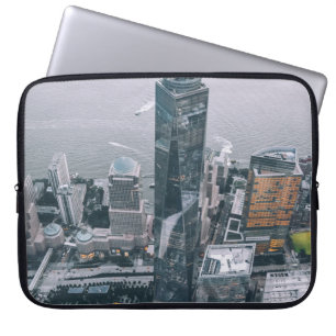 PERSON LAYING ON BUILDING LAPTOP SLEEVE