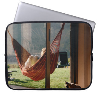 Person on brown swing laptop sleeve