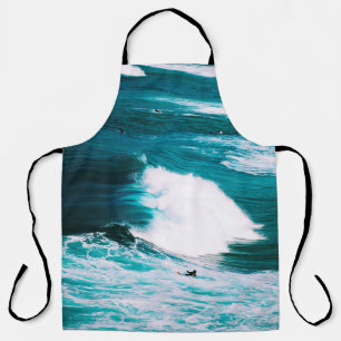 PERSON ON SURFBOARD WITH OCEAN WAVES APRON