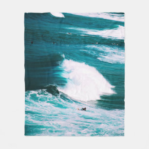 Person on surfboard with ocean waves fleece blanket