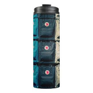 Person showing assorted-colour bags thermal tumbler