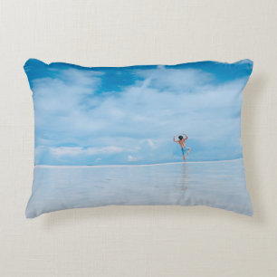 Person standing in body of water decorative cushion