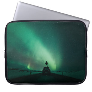 PERSON STANDING IN FRONT OF AURORA LIGHTS LAPTOP SLEEVE