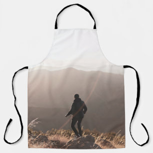 Person standing on rock apron