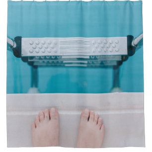 Person standing on swimming pool ladder shower curtain