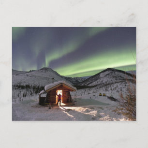 Person stands in doorway of Caribou Bluff cabin Postcard