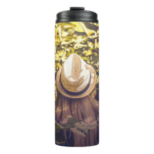 Person wearing white hat beside sunflower fields thermal tumbler