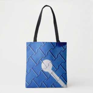 Person with wheelchain marked on purple pavement tote bag
