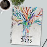 Personalised 2023 planner<br><div class="desc">This unique Planner is decorated with a brightly coloured mosaic tree on a pale grey background. Easily customisable. To edit further use the Design Tool to change the font, font size, or colour. Because we create our artwork you won't find this exact image from other designers. Original Mosaic © Michele...</div>