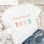 Personalised 50th Birthday Vintage 1973 T-Shirt<br><div class="desc">Celebrate a milestone birthday in style with this personalised Vintage 1973 50th Birthday T-Shirt. The classic design features a distressed vintage look, reminiscent of the era, with the bold Vintage 1973 prominently displayed. a truly personalised touch. this shirt is perfect for wearing on the special day or as a memorable...</div>