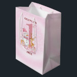 Personalised Baby’s First Christmas Snowman Medium Gift Bag<br><div class="desc">Celebrate your baby girl’s magical first Christmas with this heartwarming winter design! Featuring a cheerful snowman, reindeer, and wrapped gifts, all surrounding a pink “1st” in the centre. Personalise it with your child’s name and the year to create a memorable keepsake for new parents, grandparents, or your own family. This...</div>