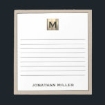 Personalised Beige Linen Gold Monogram Notepad<br><div class="desc">Stay organised in style with this personalised beige linen notepad featuring a sophisticated black and gold monogram design. The lined pages provide ample space for jotting down notes, to-do lists, and more, while the elegant design adds a touch of luxury to your everyday life. Perfect for personal use or as...</div>