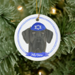 Personalised Black Great Dane Dog Hanukkah Ceramic Tree Decoration<br><div class="desc">Celebrate your favourite mensch on a bench with personalised ornament! This design features a sweet illustration of a black great dane dog with a blue and white yarmulke. For the most thoughtful gifts, pair it with another item from my collection! To see more work and learn about this artist, visit...</div>