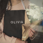 Personalised Black & Name Monogram | Elegant  Apron<br><div class="desc">Cook, bake, or grill in style with this elegant personalised apron, featuring a sleek black background and a customisable name monogram. Perfect for home chefs, bakers, or BBQ enthusiasts, this apron combines functionality and sophistication. Made with durable fabric and adjustable straps, it provides comfort and protection while you whip up...</div>