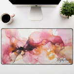Personalised Black Pink Gold Liquid Waves Desk Mat<br><div class="desc">Unveiling our Personalised Black, Pink, and Gold Liquid Waves Mat. This captivating design showcases an abstract pattern of fluid waves in an elegant harmony of black, pink, and gold tones. The striking contrast creates a luxurious feel, while the personalised feature adds a unique touch to this design. This radiant piece...</div>