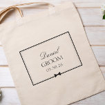 Personalised Classic Wedding Simple Bowtie Groom Tote Bag<br><div class="desc">Celebrate the groom with this elegant, personalised tote bag. Featuring a sophisticated black-and-white design, this tote can be customised with the groom's name and wedding date, creating a unique and memorable accessory for the big day. Whether it's to carry wedding essentials or as a thoughtful keepsake, this tote adds a...</div>