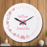 Personalised Couple Heart Wall Clock with Names<br><div class="desc">Celebrate love in a timeless way with this personalised couple heart wall clock, customised with your names for a truly meaningful touch. Designed with soft romantic hearts and elegant typography, this clock turns everyday moments into lasting memories. Perfect as an anniversary gift, wedding gift, or Valentine’s Day surprise, this custom...</div>