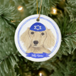 Personalised English Cream Dachshund Dog Hanukkah Ceramic Tree Decoration<br><div class="desc">Celebrate your favourite mensch on a bench with personalised ornament! This design features a sweet illustration of a fawn, tan, or cream english long haired dachshund dog with a blue and white yarmulke. For the most thoughtful gifts, pair it with another item from my collection! To see more work and...</div>