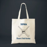 Personalised Field Hockey Team Name Jersey Number Tote Bag<br><div class="desc">This personalised field hockey design features 2 crossed field hockey sticks, a ball and your player's or coach's name, team name and jersey number. Personalise the background colour to match your team colours - just click on "customise" and then the small eye dropper. This makes a perfect for an end...</div>